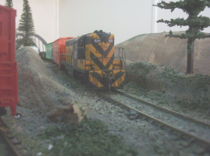 diesel loco hauls big load on model railway
